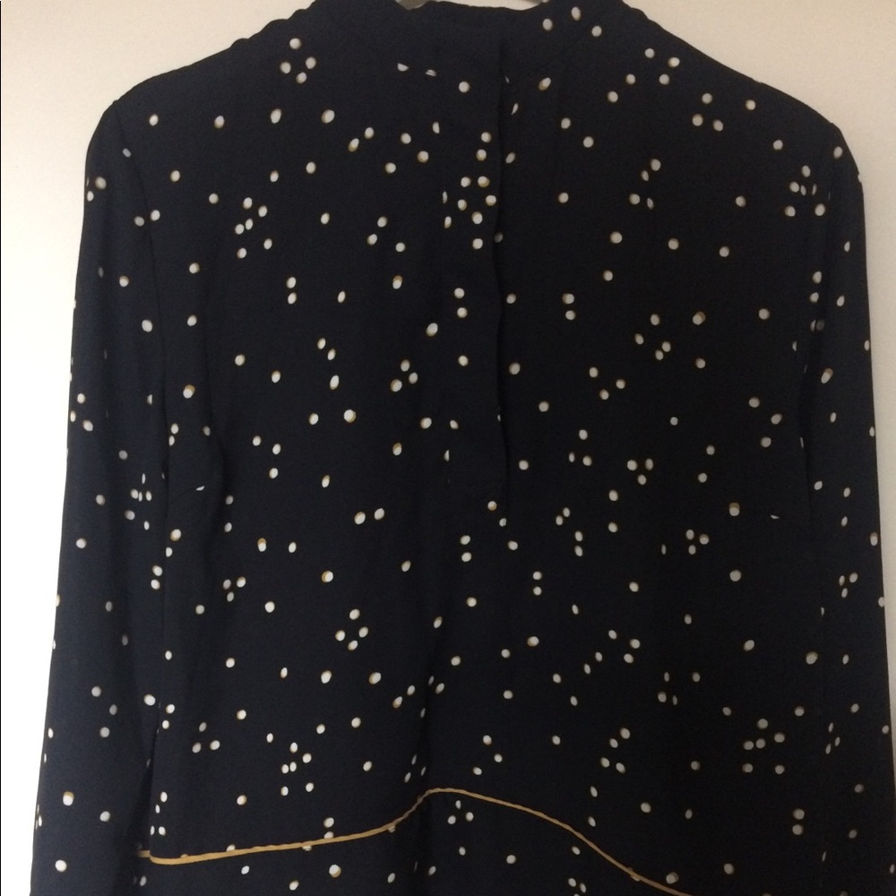 A black blouse from H&M with yellow spots.